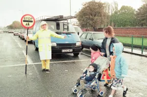 Images Dated 9th November 1995: Lollipop lady Janet Taylor on duty at the junction of Trunk Road with Kings Road