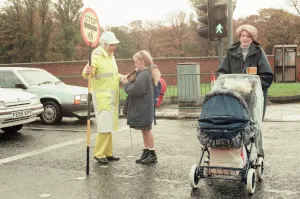 Images Dated 9th November 1995: Lollipop lady Janet Taylor on duty at the junction of Trunk Road with Kings Road