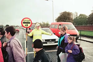 Images Dated 9th November 1995: Lollipop lady Janet Taylor on duty at the junction of Trunk Road with Kings Road