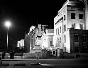 London by night two policemen stand on a bridge on the Embankment with Shellmex London by night two policemen stand on a bridge on the Embankment with Shellmex