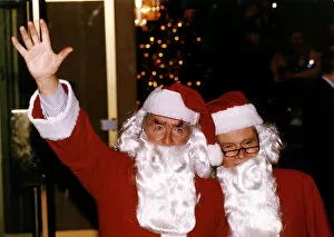 Images Dated 11th December 1992: Lord Dennis Healey With Conservative Jeffrey Archer In Santa Claus Costume At Londons