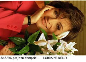 Lorraine Kelly TV presenter sitting next to green white plant Lorraine Kelly TV presenter sitting next to green white plant