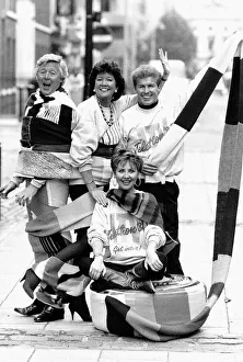 Lulu pop singer sitting on a 15 mile scarf being knitted all over the country by Lulu pop singer sitting on a 15 mile scarf being knitted all over the country by