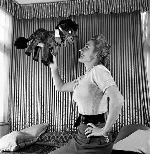 00020 Gallery: Lynne Breton. Woman with stuffed toy donkey. October 1952 C4870-002