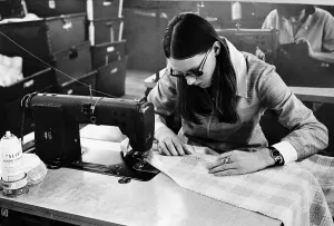 Machinist Lynn brown sews pockets onto a skirt during her shift at a textiles factory Machinist Lynn brown sews pockets onto a skirt during her shift at a textiles factory
