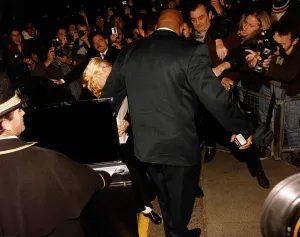 Madonna actress & singer getting out of a car with her bodyguard The Wall Madonna actress & singer getting out of a car with her bodyguard The Wall