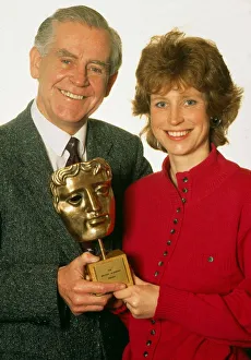 Images Dated 1st March 1990: Magnus Magnusson with daughter Sally, holding a BAFTA award. March 1990