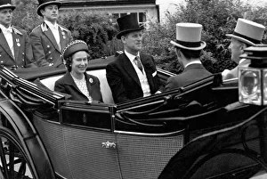 Her Majesty Queen Elizabeth II arriving at Ascot in a horse drawn carriage with her Her Majesty Queen Elizabeth II arriving at Ascot in a horse drawn carriage with her