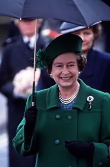 Her Majesty Queen Elizabeth II holds an umbrella during her visit to Torbay to celebrate Her Majesty Queen Elizabeth II holds an umbrella during her visit to Torbay to celebrate