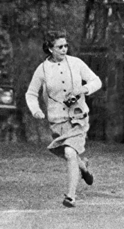 Her Majesty Queen Elizabeth II races after one of her pet corgis as she exercises them Her Majesty Queen Elizabeth II races after one of her pet corgis as she exercises them