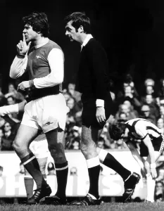 Malcolm MacDonald signals to Liam Brady April 1978 to keep quiet after a small Malcolm MacDonald signals to Liam Brady April 1978 to keep quiet after a small