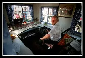 Images Dated 21st August 1999: A man inside mini at the 40th birthday party August 1999