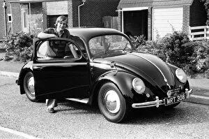 Images Dated 2nd June 1982: A man poses with a Volkswagen Beetle. 2nd June 1982