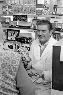 A man serving a customer in his shop at Deptford. November 1969 Z10715-004 A man serving a customer in his shop at Deptford. November 1969 Z10715-004