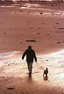Images Dated 26th October 1999: Man walking Dog on Beach in Aberdeen October 1999