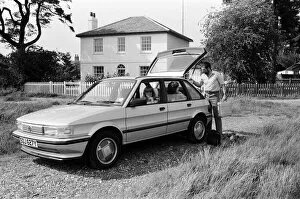 Images Dated 8th June 1983: A man, woman and girl with a MG Maestro. 8th June 1983
