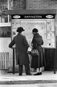 A man and woman looking at a map of Orpington, Orpington High Street, Kent A man and woman looking at a map of Orpington, Orpington High Street, Kent