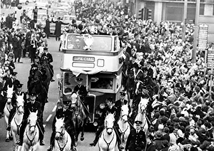 Manchester City footballers parade the FA Cup trophy to fans lining the streets of Manchester City footballers parade the FA Cup trophy to fans lining the streets of