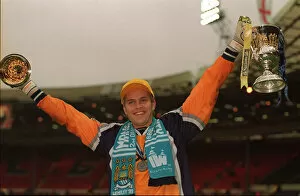 Images Dated 30th May 1999: Manchester City keeper Nick Weaver celebrates May 1999 with trophy folowing