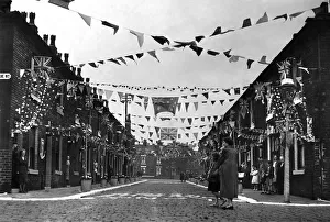 A Manchester street decked out with coronation decorations in celebration of A Manchester street decked out with coronation decorations in celebration of