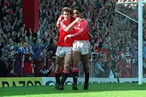 Manchester United footballer Mark Hugfhes celebrates a goal with teammate Paul Ince at