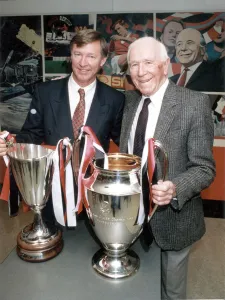 00468 Gallery: Manchester United manager Alex Ferguson and former manager Sir Matt Busby posing with