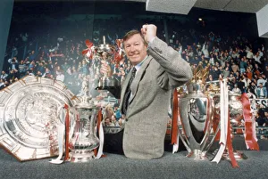 00468 Gallery: Manchester United manager Alex Ferguson posing with the trophies won in the 1993 - 1994