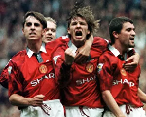 Images Dated 13th September 1997: Manchester United Player David Beckham celebrates with team mates Gary Neville (left