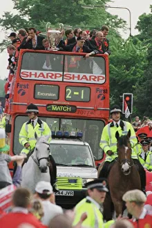 Manchester United team on open top bus May 1999 during their homecoming tour of Manchester United team on open top bus May 1999 during their homecoming tour of