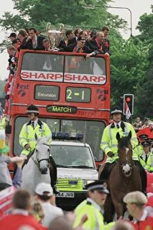Images Dated 28th May 1999: Manchester United team on open top bus May 1999 during their homecoming tour of
