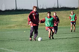 Images Dated 18th November 1996: Manchester United in training. David Beckham on the ball challenged by Ben