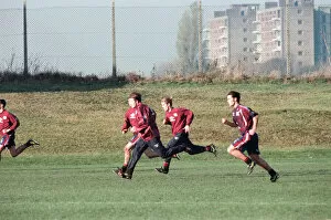 Images Dated 18th November 1996: Manchester United in training. David Beckham running with Gary (hidden