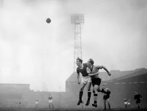 Manchester United v Wolverhampton Wanderers - Billy Wright beats Viollet in the air Manchester United v Wolverhampton Wanderers - Billy Wright beats Viollet in the air