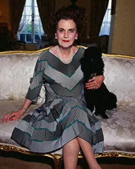 Margaret Duchess of Argyll February 1990. with her pet poodle on sofa sitting