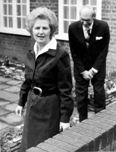 Margaret Thatcher and husband Denis Thatcher as she leaves for work - March 1977 Margaret Thatcher and husband Denis Thatcher as she leaves for work - March 1977