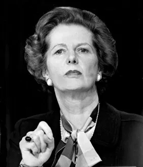 Margaret Thatcher looking serious and forbidding during press conference / speech - June