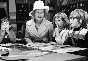 00047 Gallery: Margaret Thatcher sits with children taking a reading class at the Northern Councties