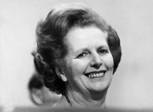 Images Dated 19th October 1982: Margaret Thatcher smiling on podium at Tory party conference - October 1982