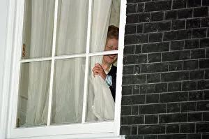 Margaret Thatcher watches John Major from a window at 10 Downing Street after he won