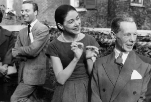 01429 Gallery: Margot Fonteyn and dancer Stanislas Izikowski talking in garden at party - October 1958