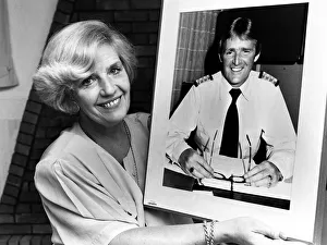 Marie Duffy with a photograph of her husband John who is Hotel Manager of the QE2 which Marie Duffy with a photograph of her husband John who is Hotel Manager of the QE2 which