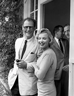 Marilyn Monroe arm in arm with husband Arthur Miller July 1956. smiling Marilyn Monroe arm in arm with husband Arthur Miller July 1956. smiling