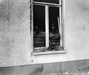 Marines of the British Naval Brigade seen here sniping at the enemy from the windows of Marines of the British Naval Brigade seen here sniping at the enemy from the windows of