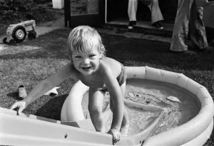 Mark Gordon cools off from the summer sun in his paddling pool. 28th June 1976 Mark Gordon cools off from the summer sun in his paddling pool. 28th June 1976