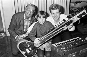 Images Dated 2nd March 1988: Martine Bochat (centre) gets a lesson on the sitar from Virendra Bhatt (left