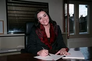00138 Gallery: Martine McCutcheon Actress September 98 Eastenders actress sitting at desk