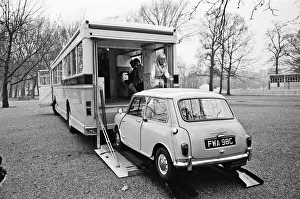 A massive road cruiser with parking inside for a Mini was driven through London A massive road cruiser with parking inside for a Mini was driven through London
