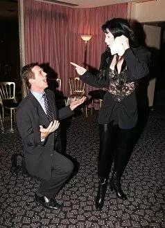 Images Dated 9th August 1996: Matthew Wright Staff writer on the daily Mirror begs for forgiveness from pop singer Cher