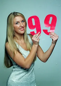 The Max Cover December 1998 Model Erin Gavin holding the number 99 The Max Cover December 1998 Model Erin Gavin holding the number 99
