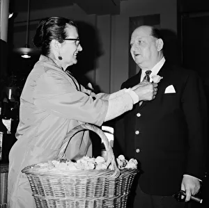 Media Mogul Lew Grade receives a flower frm seller Mrs Louise Noel at Simpsons of Media Mogul Lew Grade receives a flower frm seller Mrs Louise Noel at Simpsons of